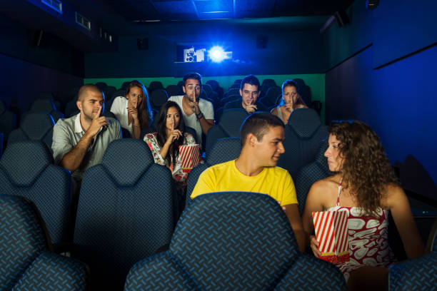 istock Noisy couple in cinema 957389794