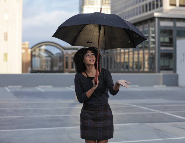 istock Woman with umbrella 957390000