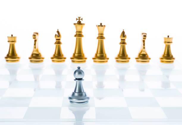 istock The silver pawn standing in the front 957392852