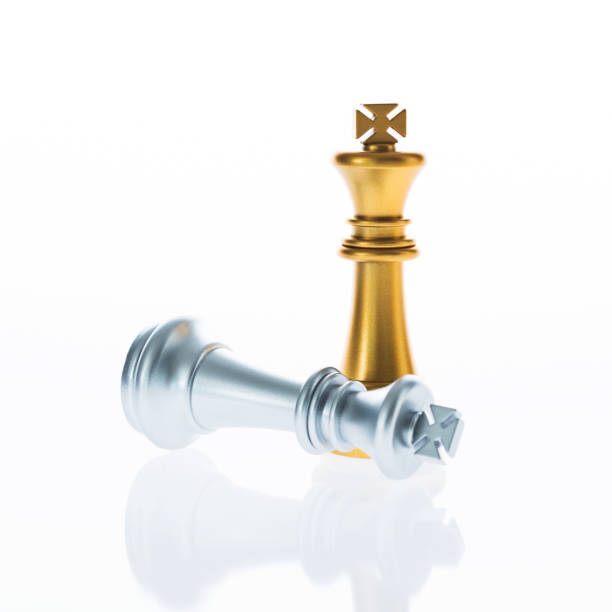 istock Golden king standing and silver lying 957393154