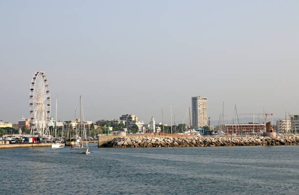istock panoramic wheel and Rimini port summer season 957398712