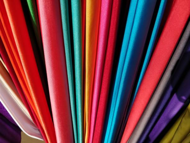 selection of colorful fabrics - textile textile industry warehouse store imagens e fotografias de stock