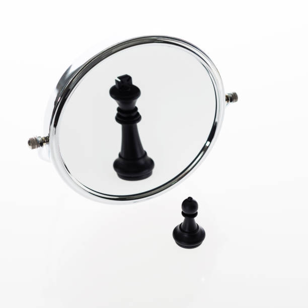 istock Black chess pawn imagining itself as a king 957404508