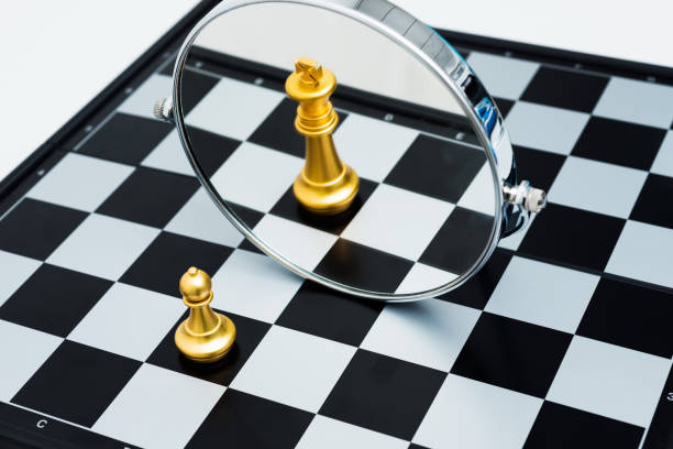 istock Golden chess pawn imagining itself as a king 957404962