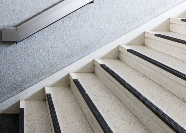istock Old marble staircase with the metal rail. 957404982