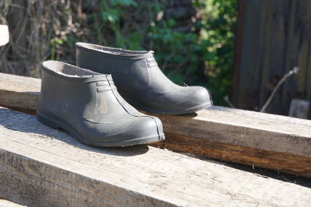 istock Rubber galoshes on the boards 957407628