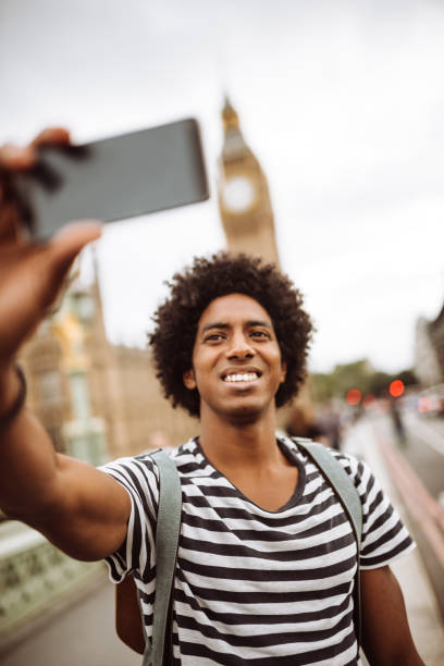 istock tourist in london take a selfie 957408168