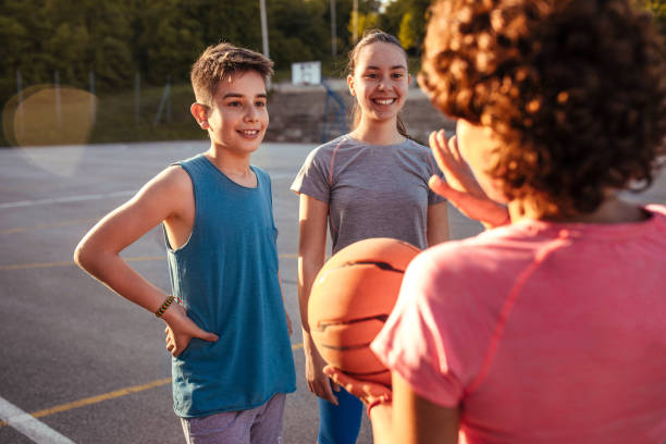 istock Female coach with her basketball team 957408264