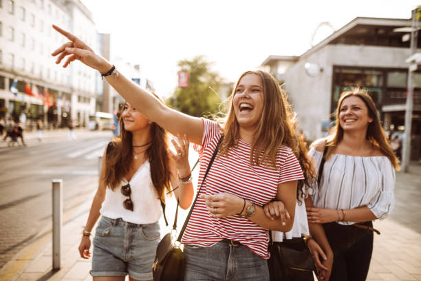 istock teens friends walking in the city 957408700