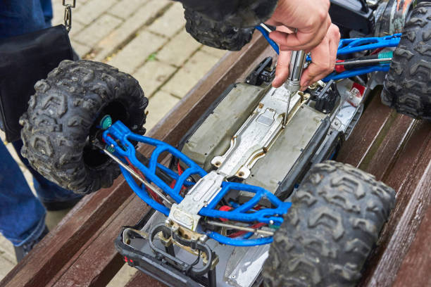 istock Man is repairing Radio-controlled car 957410900
