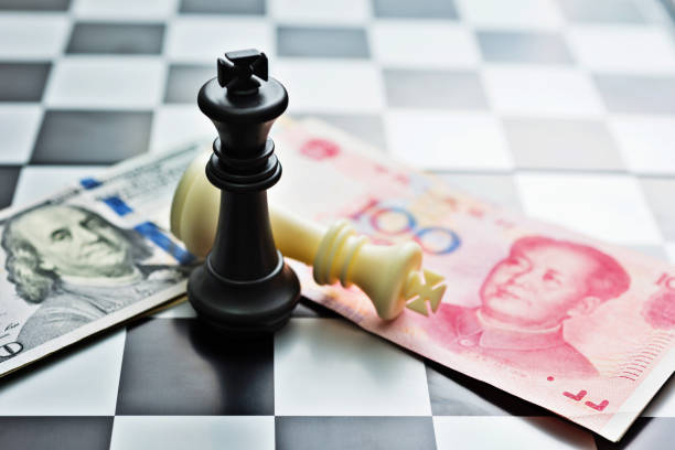 istock Chess pieces and paper currency 957415862