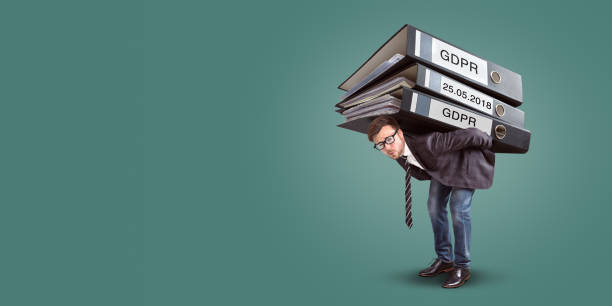 Man carrying an enormous stack of GDPR files
