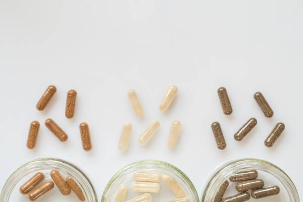Medicinal capsule spill out of a three plastic bottles