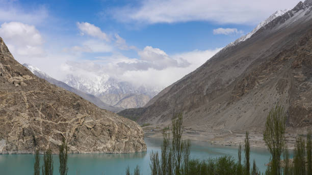 istock Attabad lake under blue cloudy sky 957417150