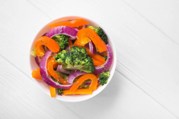 istock Fresh low-calorie salad with broccoli, pepper and onion 957417352