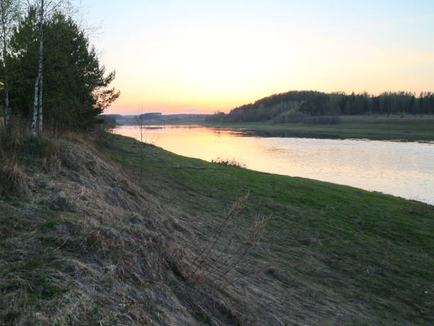 istock banks of the river on a spring day 957421924