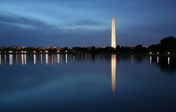 istock Washington Monument lit up at night with water in the front 95742234