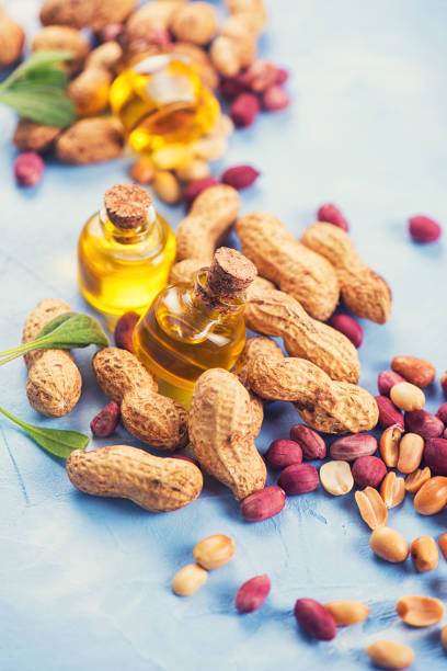 istock Natural peanut with oil in a glass 957423758
