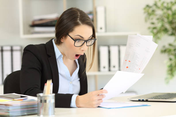 istock Amazed executive checking sales results at office 957428318
