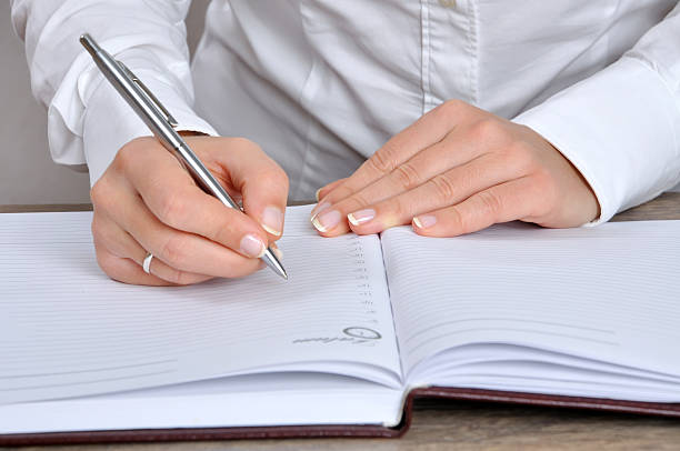 istock Woman Hand and pencil 95742914