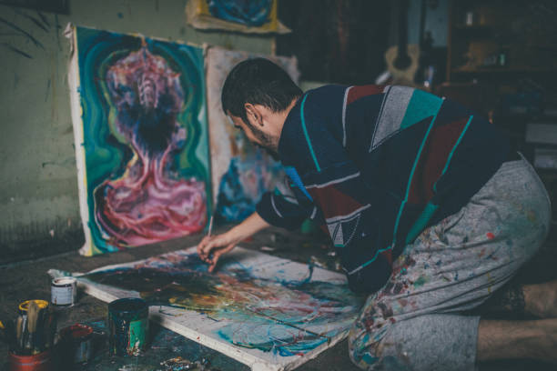istock Man painting on the floor 957431106