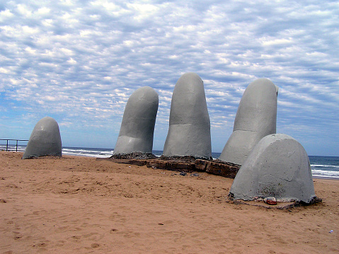 Punta del Este, Uruguay, South America: - La Mano (The Hand) is a sculpture in Punta del Este by Chilean artist Mario Irarrázabal.