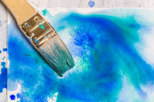 istock Grunge watercolor Background Texture - Blue with paintbrush 957433238