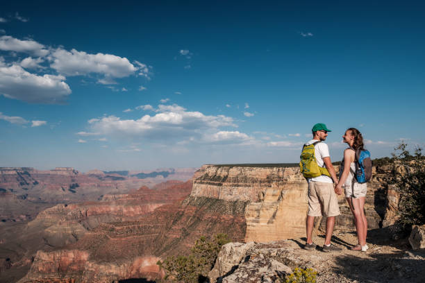 istock Tourists with backpack hiking at Grand Canyon 957439768