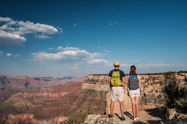 istock Tourists with backpack hiking at Grand Canyon 957439776