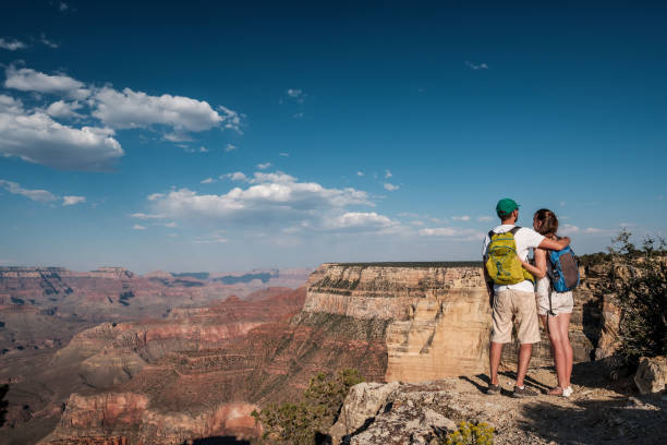 istock Tourists with backpack hiking at Grand Canyon 957439800