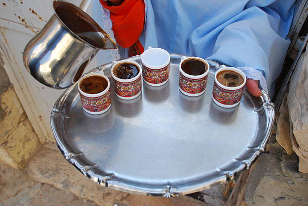 istock Palestinian woman pours coffee in Jerusalem 95744095