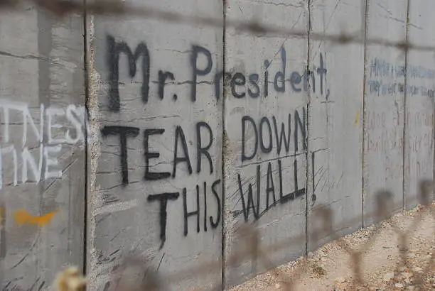 Photo of Graffiti in Bethlehem referencing Ronald Reagan in Berlin