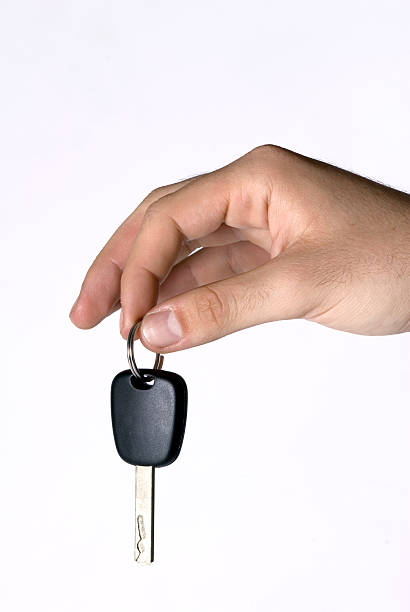 istock Man hand holding key, close-up 95744349