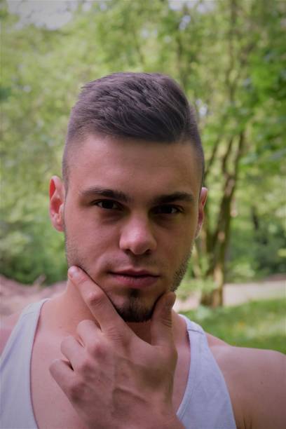 istock the man is holding his chin 957452138