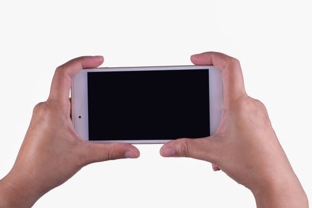 istock woman hand and holding a smart phone 957453962