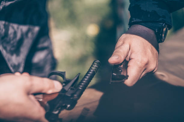 istock The instructor shows how to disassemble and assemble a pistol 957458836