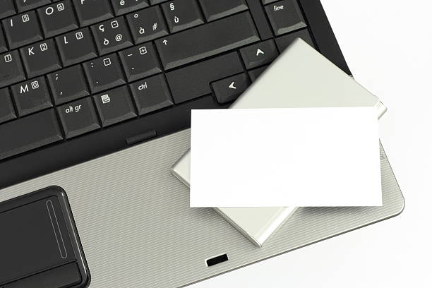 istock blank business card on laptop keyboard 95746281