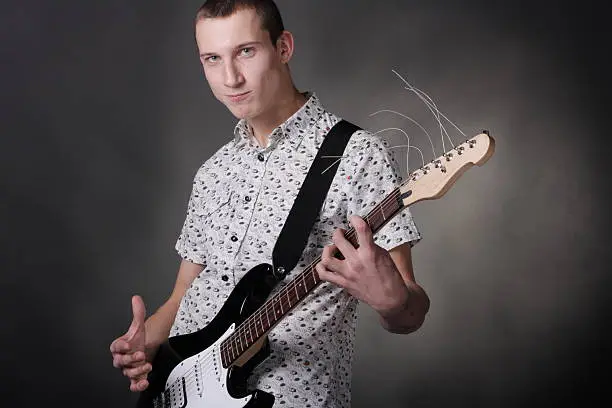 Photo of Pop Musician holding the guitar