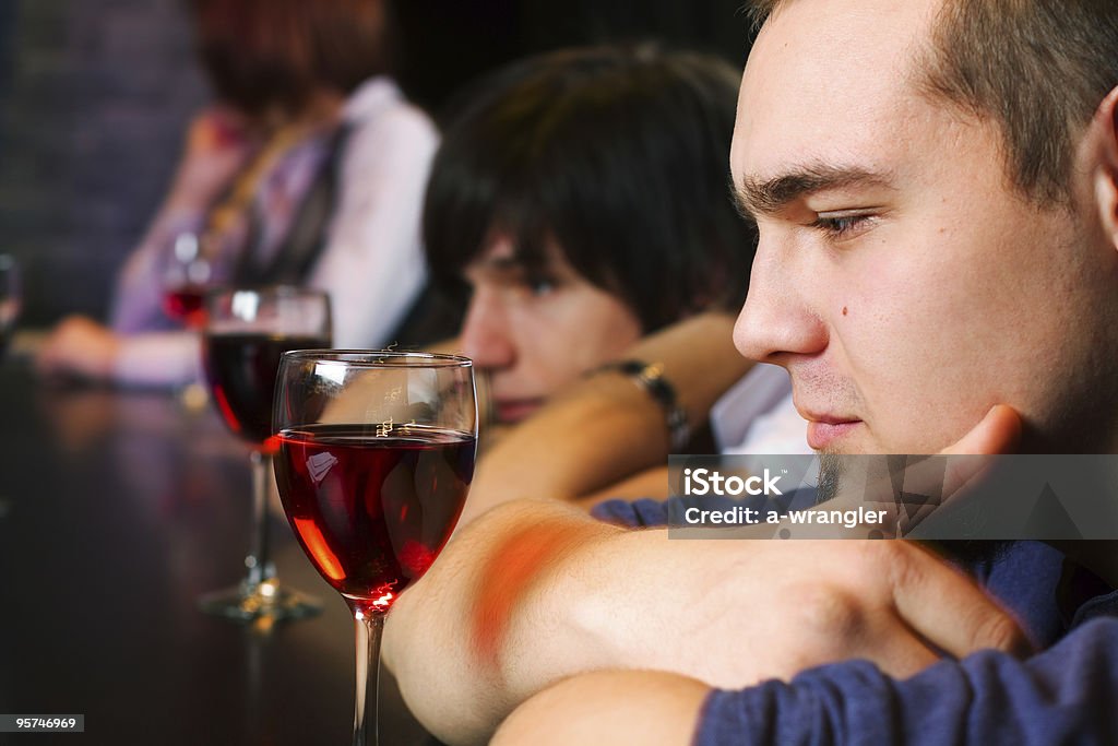 Young men relaxing in a night bar  Adult Stock Photo