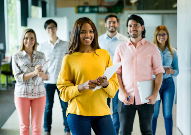 istock Woman leading a team at a creative office 957477102