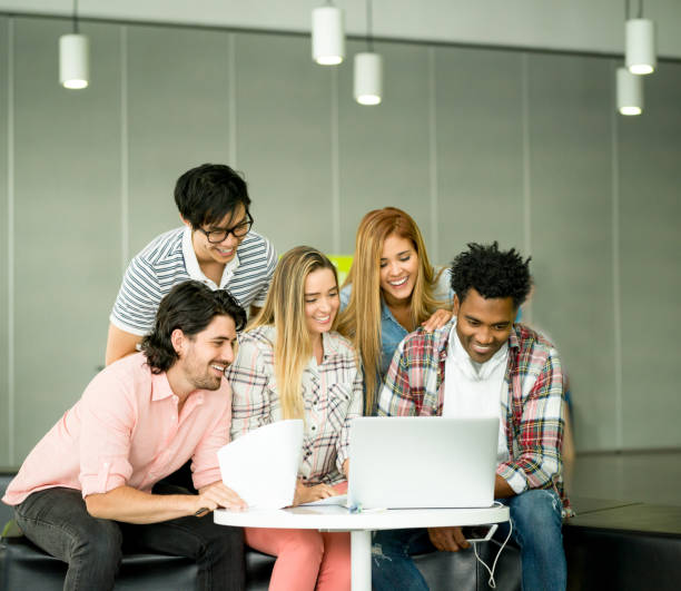 istock Group of people working online at a creative office 957477330
