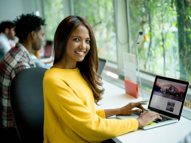 istock Happy woman working online at a creative office 957477460