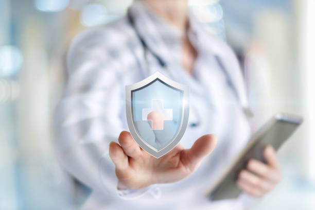 Doctor puts the protection of health . Doctor puts the protection of health on blurred background. providence rhode island photos stock pictures, royalty-free photos & images
