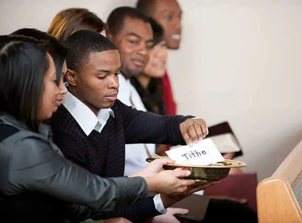 People giving tithes and offerings in church - Buy credits