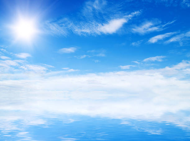 istock white fluffy clouds with rainbow in the blue sky 957495292