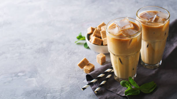 https://media.istockphoto.com/id/957499598/photo/iced-coffee-in-tall-glasses-with-cream-and-pieces-of-sugar-mint-and-straw.jpg?s=612x612&w=0&k=20&c=3NYChJDW02CimGjdSppdSrelsisBTNjeb6pyN1wwZqU=