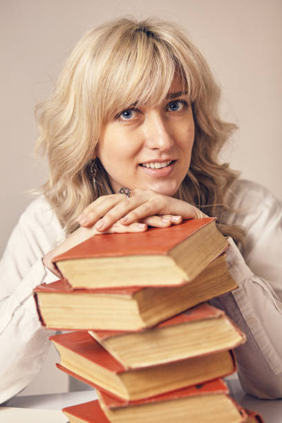 istock a business woman and books 957520428
