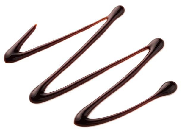 istock Chocolate sauce. Hot sweet liquid. Wave isolated on white background. 957521008