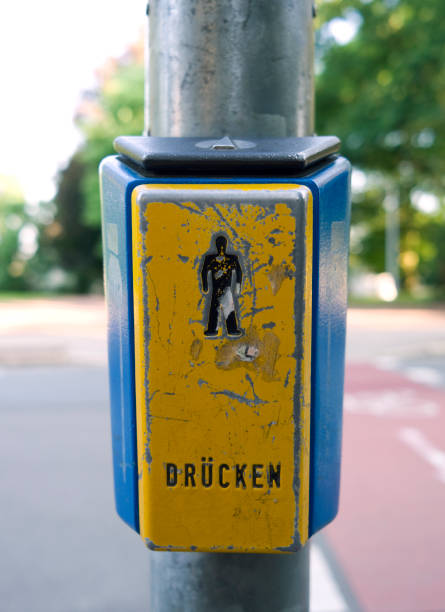 istock Traffic: Worn push button of a pedestrian traffic light 957527284