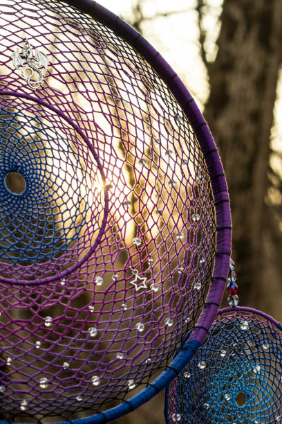 istock Handmade dream catcher with feathers threads and beads rope hanging 957532542